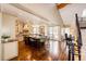 Open kitchen with a large island, seating, stainless steel appliances, and hardwood floors at 789 Zamia Ave, Boulder, CO 80304
