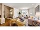 Bright living room featuring hardwood floors, neutral tones, and large window at 789 Zamia Ave, Boulder, CO 80304