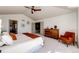 Bright main bedroom features a ceiling fan and views into the closet at 789 Zamia Ave, Boulder, CO 80304