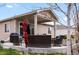 Inviting covered patio with outdoor seating, perfect for relaxing and entertaining at 1694 Castle Vista Way, Castle Rock, CO 80104