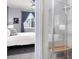 Modern bathroom features shower, stylish fixtures, and view into the bedroom at 1694 Castle Vista Way, Castle Rock, CO 80104