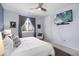 This stylish bedroom features a large window and TV, creating a comfortable and entertaining space at 1694 Castle Vista Way, Castle Rock, CO 80104