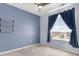 This bedroom features a large window offering great views at 1694 Castle Vista Way, Castle Rock, CO 80104