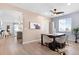Dining room with a black table, seating for six, and a view into the living room and kitchen at 1694 Castle Vista Way, Castle Rock, CO 80104