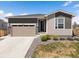 Charming single-story home featuring a 2-car garage and well-manicured front yard at 1694 Castle Vista Way, Castle Rock, CO 80104