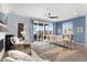 Comfortable living room with a ceiling fan, fireplace, and sliding glass doors to a patio at 1694 Castle Vista Way, Castle Rock, CO 80104