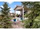 Charming covered patio with comfortable seating and lovely backyard scenery at 1694 Castle Vista Way, Castle Rock, CO 80104