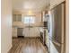 Modern kitchen with stainless steel appliances and white cabinets at 8470 Decatur St # 89, Westminster, CO 80031