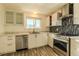 Modern kitchen with stainless steel appliances and white cabinets at 8470 Decatur St # 89, Westminster, CO 80031