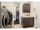 Convenient laundry room with washer, dryer, and storage at 7800 E 148Th Dr, Thornton, CO 80602