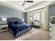 Main bedroom with bay window, ceiling fan, and ample natural light at 7800 E 148Th Dr, Thornton, CO 80602