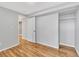 Finished basement bedroom with wood-look flooring and closet at 740 Fulton Ave, Fort Lupton, CO 80621