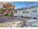 House exterior showcasing a gray color scheme, landscaping, and a walkway at 740 Fulton Ave, Fort Lupton, CO 80621