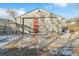 View of a detached garage with double doors and a concrete area at 740 Fulton Ave, Fort Lupton, CO 80621