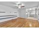 Open living room with hardwood floors and a view of the kitchen at 740 Fulton Ave, Fort Lupton, CO 80621