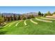 Expansive backyard featuring lush green lawn and decorative stone terraces, perfect for outdoor enjoyment at 2155 S Deframe St, Lakewood, CO 80228