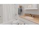 Cozy bathroom showcases a tub, a granite countertop vanity, and decorative accents at 2155 S Deframe St, Lakewood, CO 80228