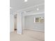 Spacious carpeted bedroom with large mirrored closet door and natural light at 2155 S Deframe St, Lakewood, CO 80228