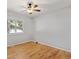 Spacious room with wood floors and a large window providing lots of natural light at 2155 S Deframe St, Lakewood, CO 80228
