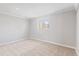 Bright bedroom with neutral carpet and natural light from a window at 2155 S Deframe St, Lakewood, CO 80228