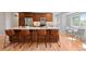 Updated kitchen with stainless steel appliances, a granite countertop island and seating for four at 2155 S Deframe St, Lakewood, CO 80228
