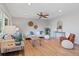 Bright living room with ceiling fan, hardwood floors, neutral color palette, and stylish decor at 2155 S Deframe St, Lakewood, CO 80228