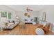 Spacious living room with lots of seating, hardwood flooring, and a ceiling fan at 2155 S Deframe St, Lakewood, CO 80228
