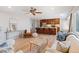 Open-concept living room seamlessly connects to the updated kitchen with lots of seating and natural light at 2155 S Deframe St, Lakewood, CO 80228