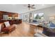 Bright, open living space with an updated kitchen, granite counters, stainless appliances and hardwood floors at 2155 S Deframe St, Lakewood, CO 80228