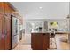 Open living space with updated kitchen, a granite island, stainless appliances and lots of room to relax at 2155 S Deframe St, Lakewood, CO 80228