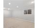Neutral carpeted bonus room with a window and recessed lighting at 2155 S Deframe St, Lakewood, CO 80228