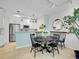Dining area with modern lighting and stainless steel appliances at 2716 W Greens Dr, Littleton, CO 80123