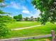 Scenic golf course view features lush green grass and well-maintained greens at 2716 W Greens Dr, Littleton, CO 80123