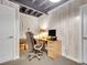Comfortable office area with a desk, ergonomic chair, and ample storage at 2716 W Greens Dr, Littleton, CO 80123