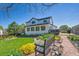 Beautiful backyard with green lawn, stone patio, garden, mature trees and plantings, great for outdoor living at 12408 W 83Rd Ave, Arvada, CO 80005