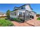 A view of the patio with stone, outdoor living with mature landscaping, and privacy at 12408 W 83Rd Ave, Arvada, CO 80005