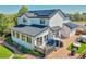 Beautiful house with solar panels, deck and patio with seating, outdoor grill, and mature landscaping at 12408 W 83Rd Ave, Arvada, CO 80005