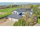 Home exterior with a three car garage and solar panels at 12408 W 83Rd Ave, Arvada, CO 80005