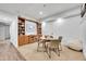 Entertainment room with built-in shelves, board games, and comfortable seating at 12408 W 83Rd Ave, Arvada, CO 80005