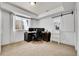 Bright home office with dual monitors, a ladder to a lofted area, and natural light at 12408 W 83Rd Ave, Arvada, CO 80005
