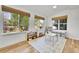 Spacious playroom with natural light, wood floors, and toy storage at 12408 W 83Rd Ave, Arvada, CO 80005