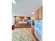 Well-lit kitchen featuring wooden cabinets, stainless steel appliances, and a granite countertop at 14248 E Hampden Ave, Aurora, CO 80014