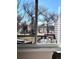 Inviting view from the home showcasing an outdoor deck, trees, and a serene body of water at 14248 E Hampden Ave, Aurora, CO 80014