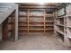 Unfinished basement storage area with concrete floor and exposed wood framing at 136 W Maple Ave, Denver, CO 80223