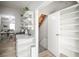 Bright kitchen featuring granite countertops, floating shelves and a view into the dining and living room at 136 W Maple Ave, Denver, CO 80223