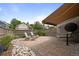 Backyard patio featuring outdoor furniture, decorative landscaping, an awning, and privacy fencing at 6900 W Grant Ranch Blvd # 88, Denver, CO 80123