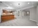 Finished basement with a dry bar, recessed lighting, and plush carpet in a neutral color palette at 6900 W Grant Ranch Blvd # 88, Denver, CO 80123