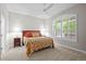 Bright bedroom featuring a ceiling fan, carpeted floor, and a large window with shutters at 6900 W Grant Ranch Blvd # 88, Denver, CO 80123