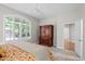 Bedroom featuring a large window, ceiling fan, and carpeted floor at 6900 W Grant Ranch Blvd # 88, Denver, CO 80123