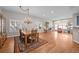 Bright, open dining room with hardwood floors, chandelier, and large windows at 6900 W Grant Ranch Blvd # 88, Denver, CO 80123